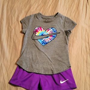 Girls Nike set sz 4. Purple shorts and gray short sleeve shirt with Nike symbol.